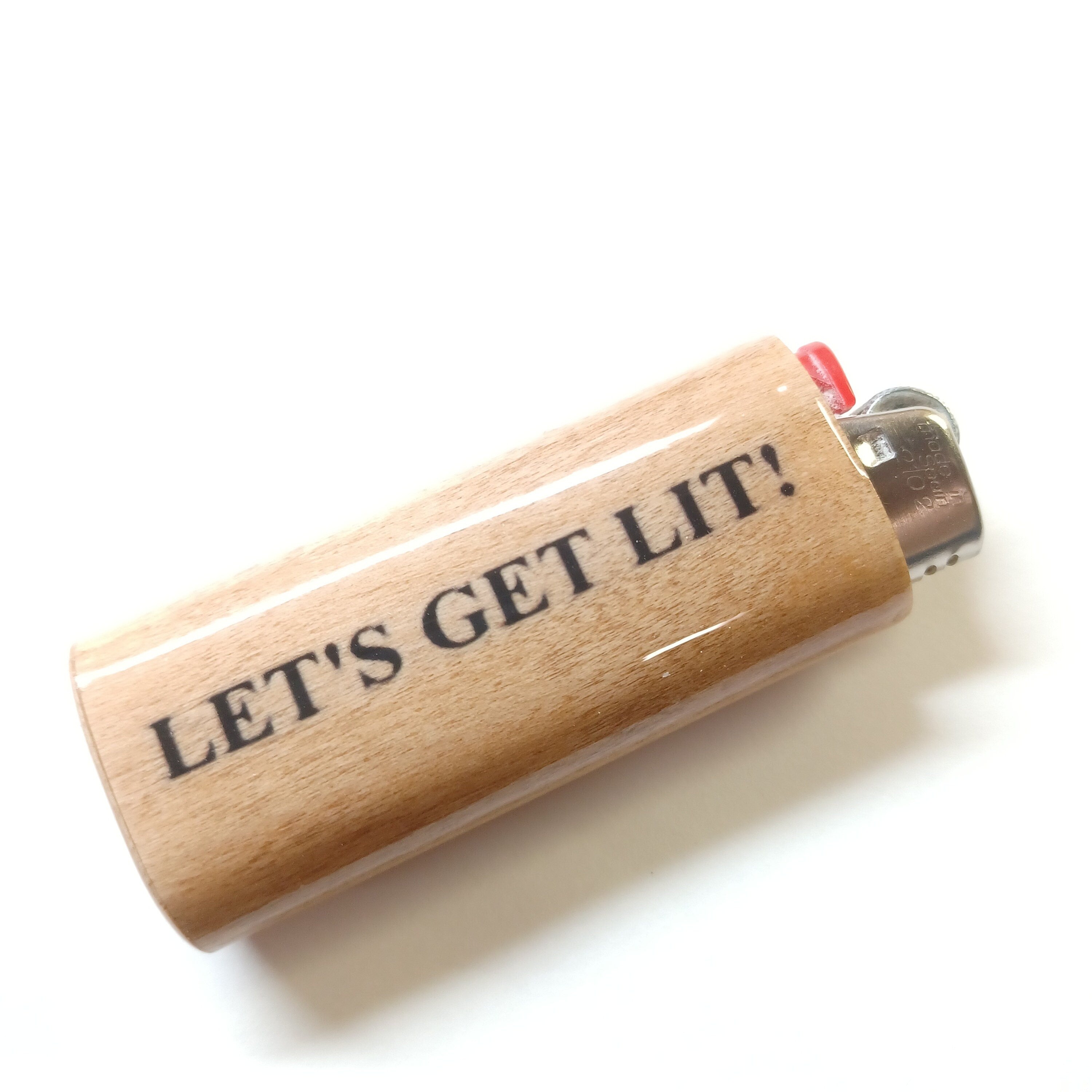 Wooden lighter with 'LET'S GET LIT!' text on a white background