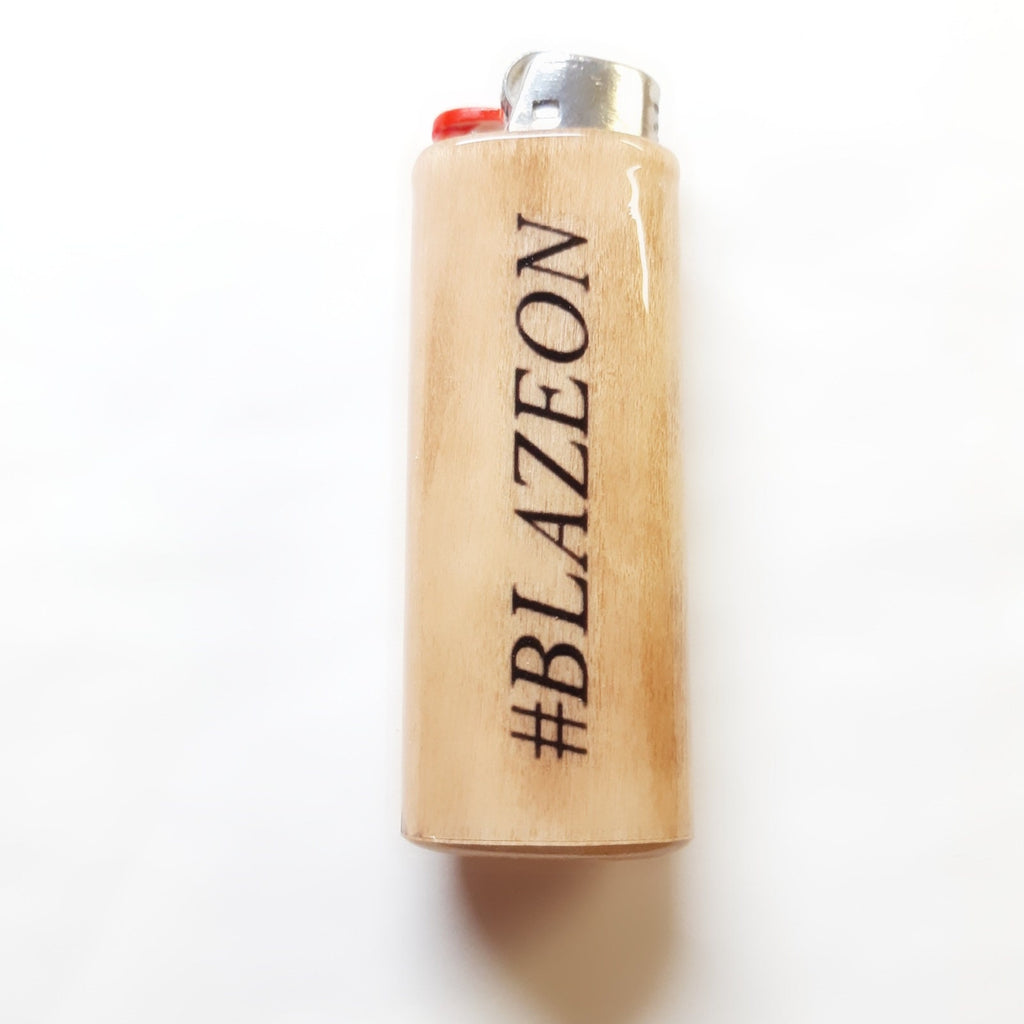 Wooden lighter with '#BLAZEON' branding on a white background