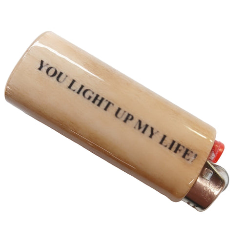 Lighter with 'You light up my life' text on a white background