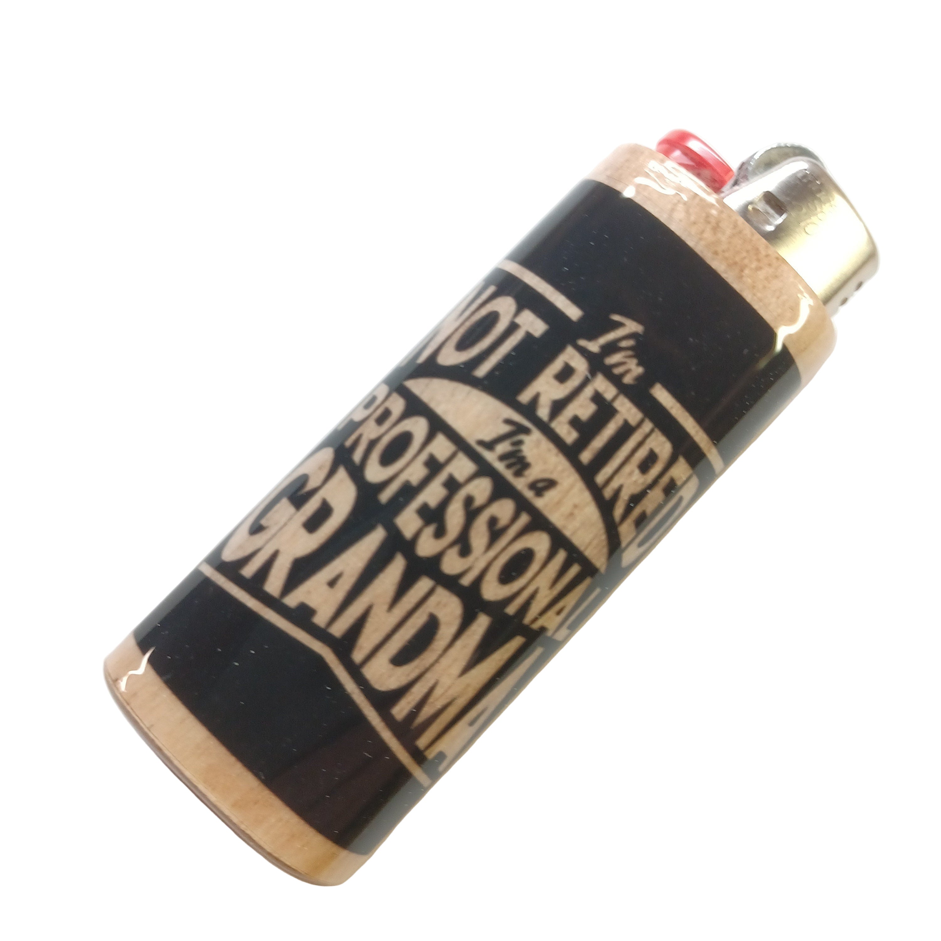 Lighter with text 'I'm not retired, I'm a professional grandma' on a white background