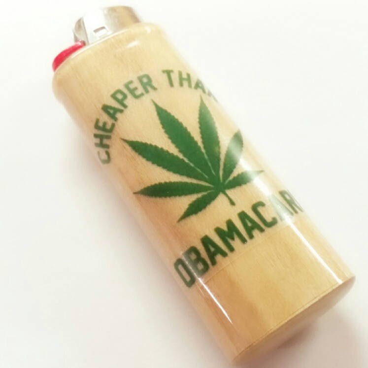 Lighter with a cannabis leaf and text on a white background