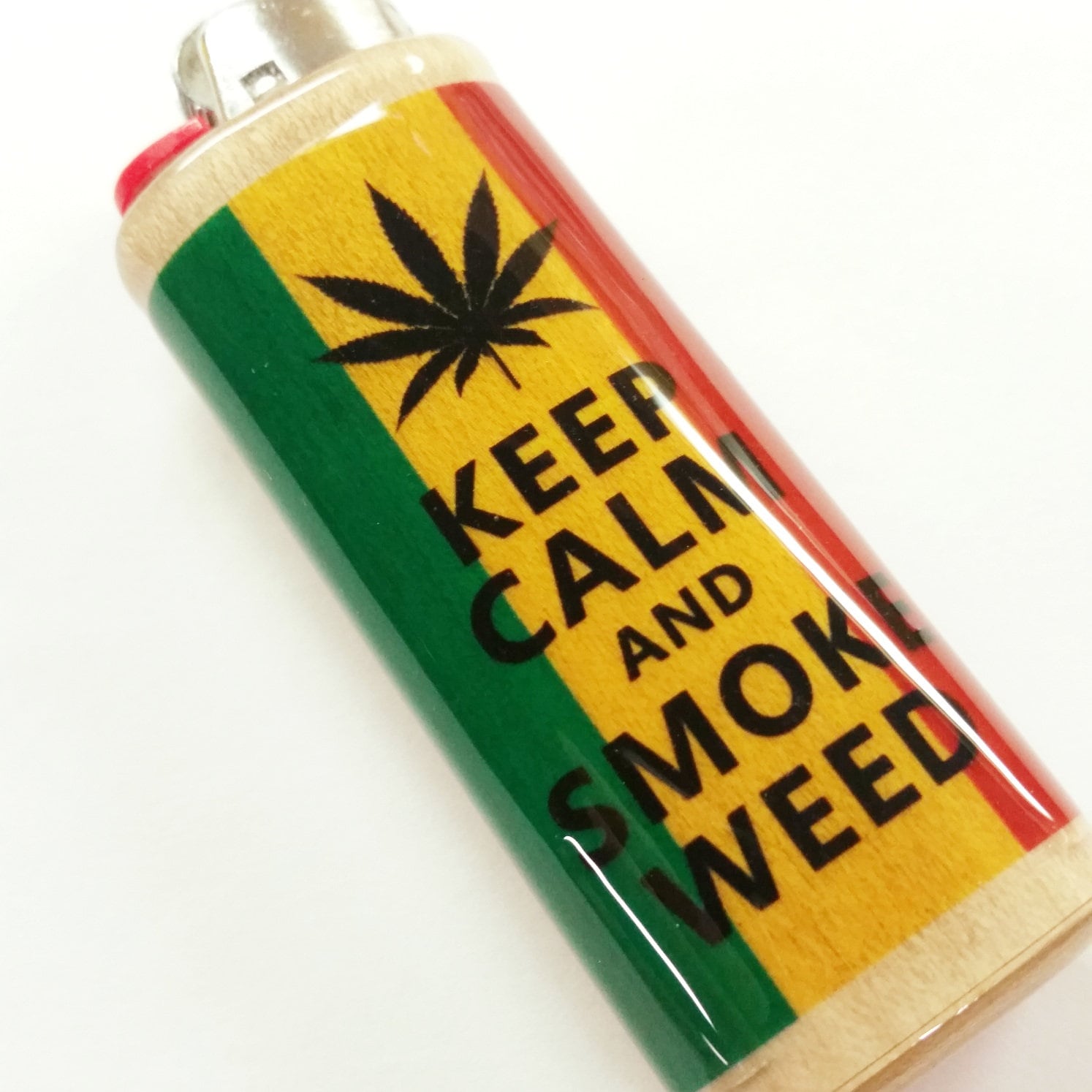 Lighter with 'Keep Calm and Smoke Weed' text and cannabis leaf design on a white background