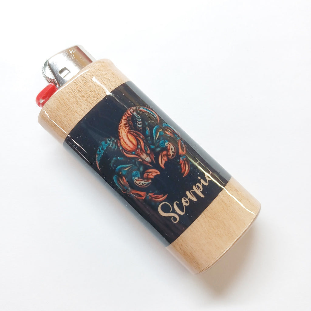 Lighter with Scorpio design on a white background