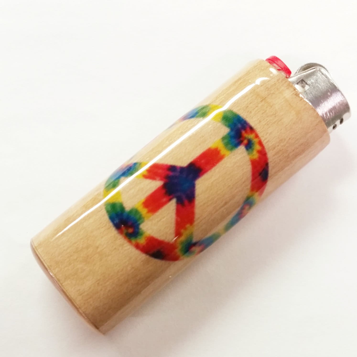 Lighter with a colorful peace symbol design on a white background