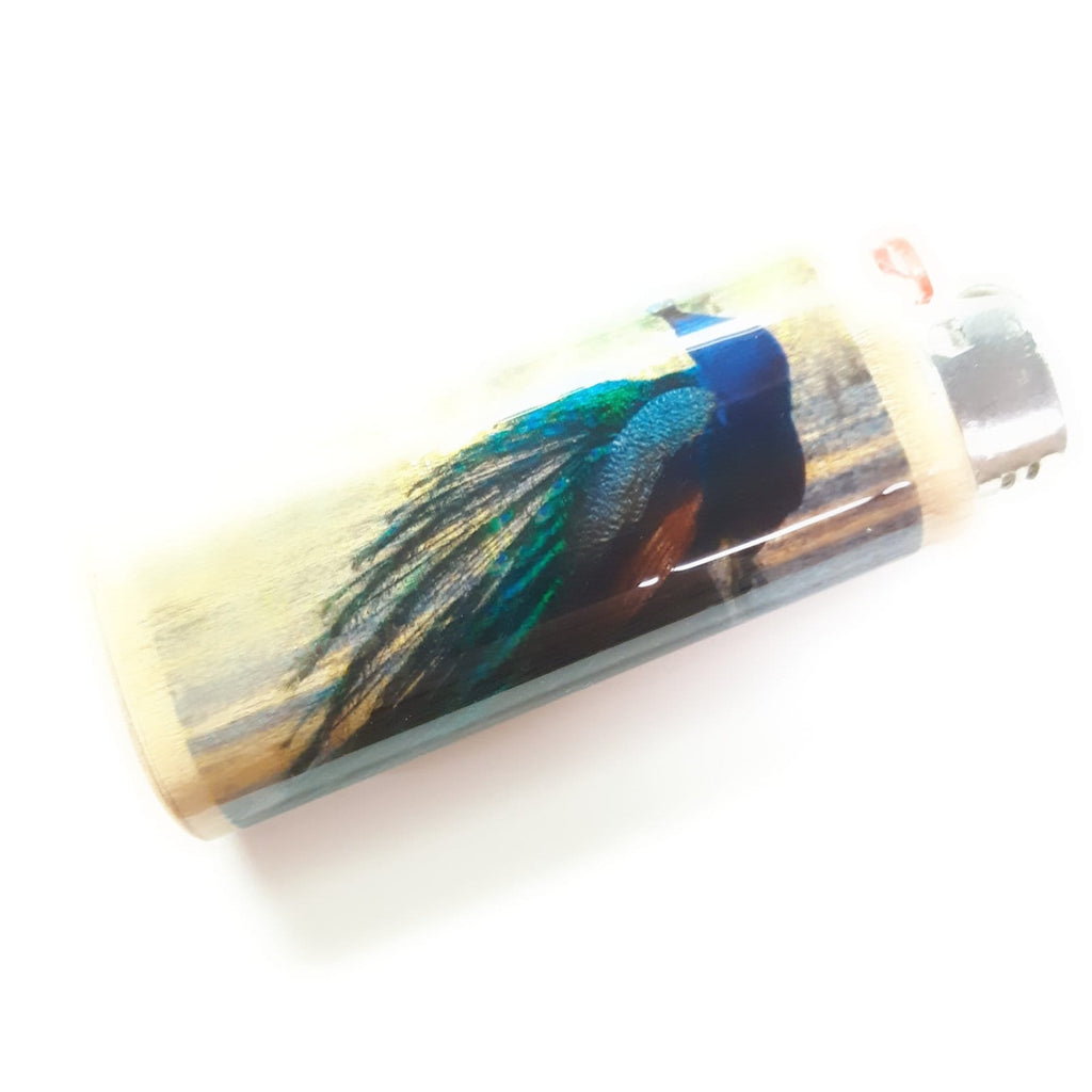 Lighter case with peacock feather design on a white background