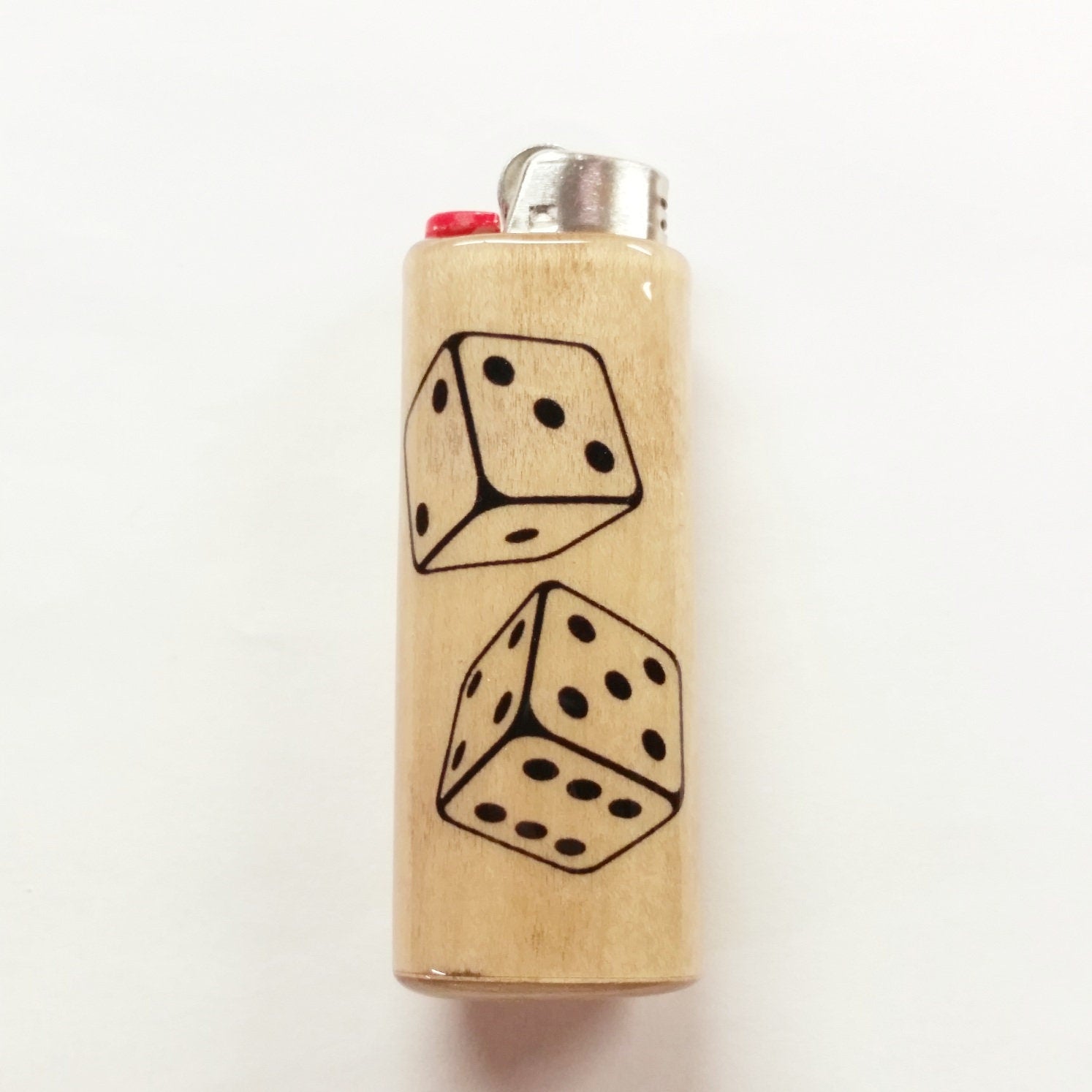 Wooden lighter with dice design on a white background