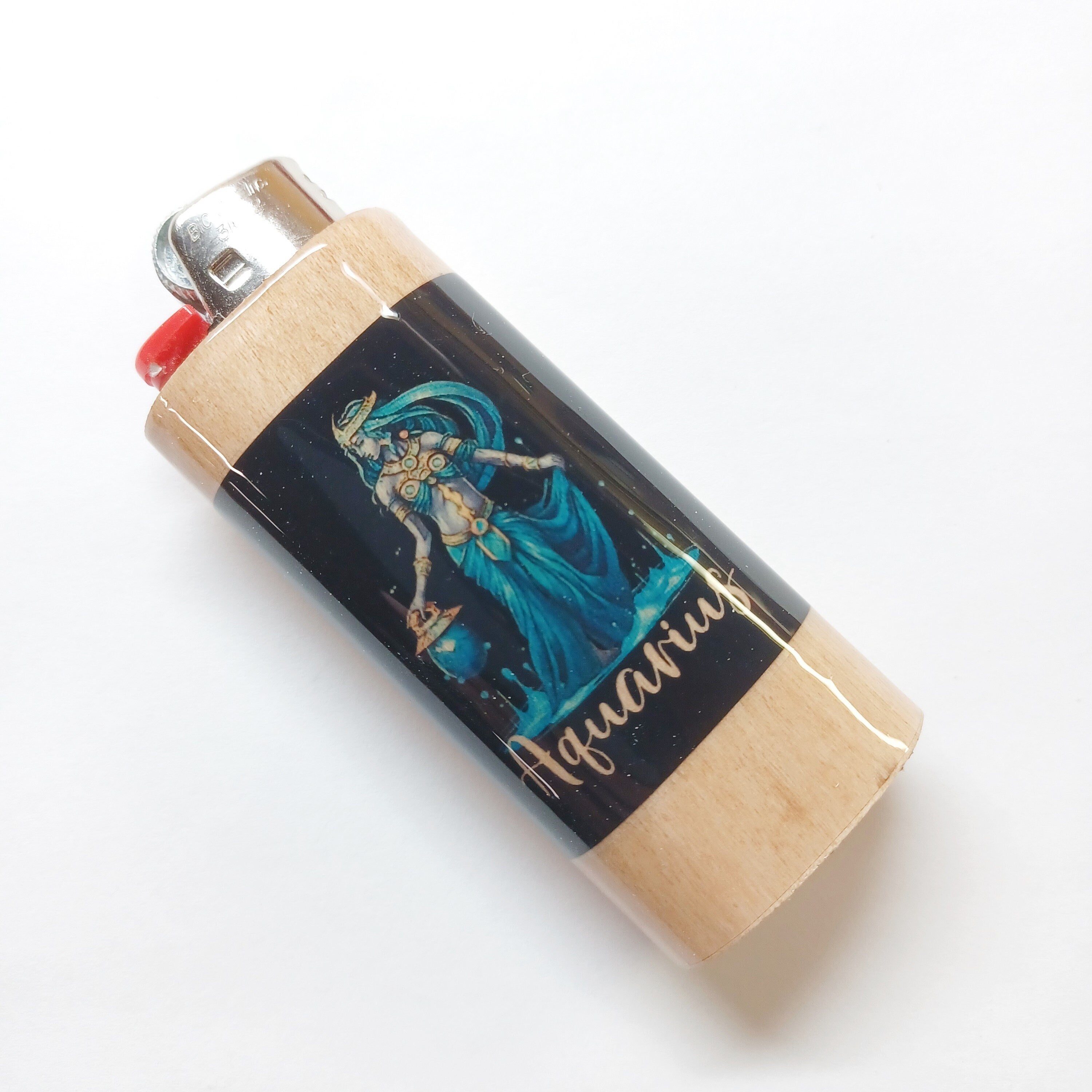 Lighter with a decorative design and 'Aquarius' text on a white background