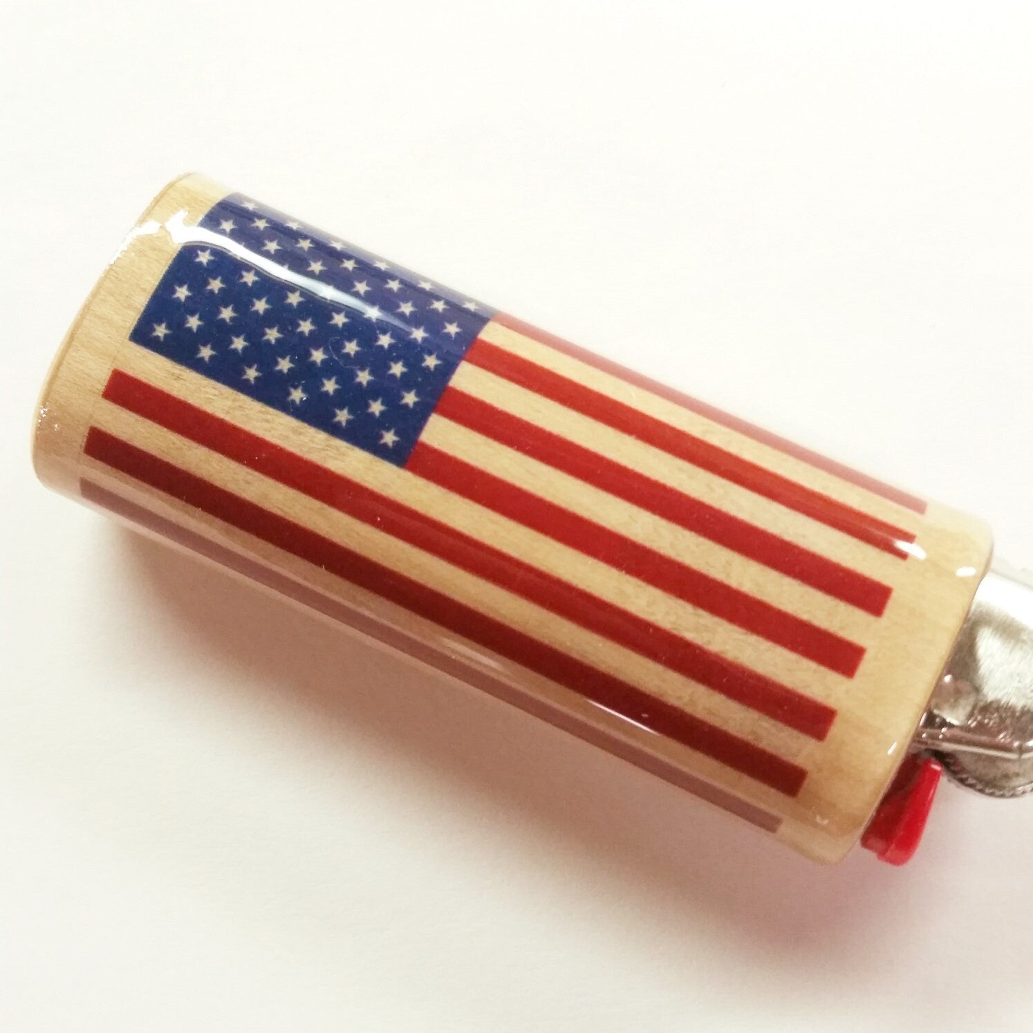 Lighter with American flag design on a white background