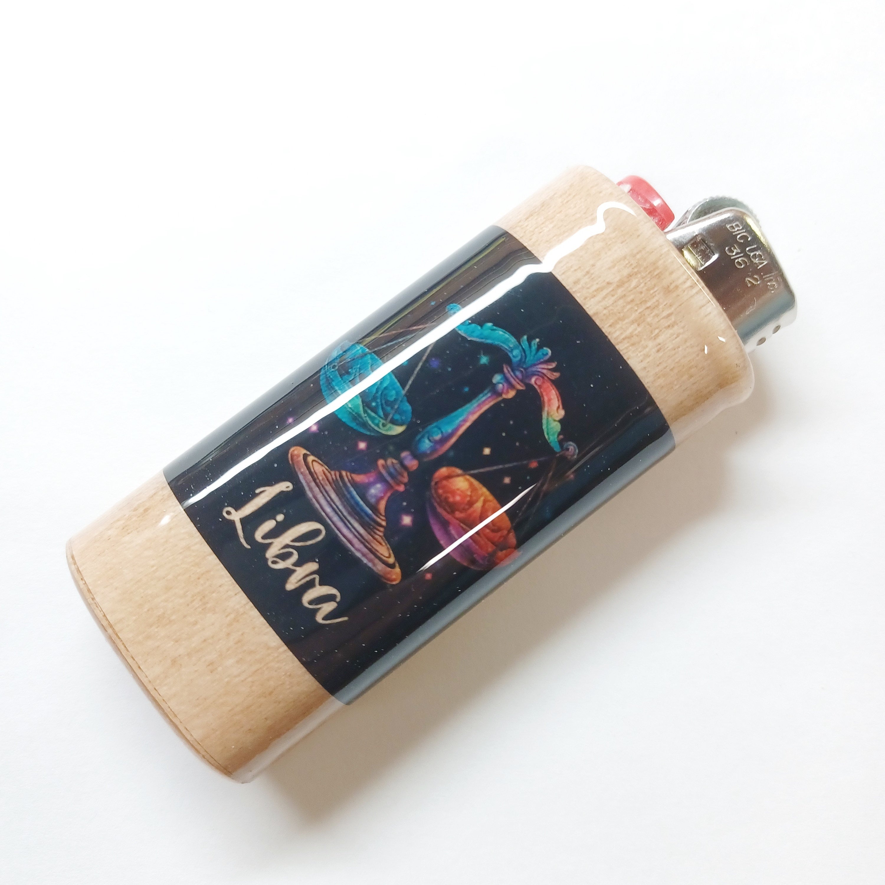 Lighter with colorful astrological design and 'Libra' text on a white background