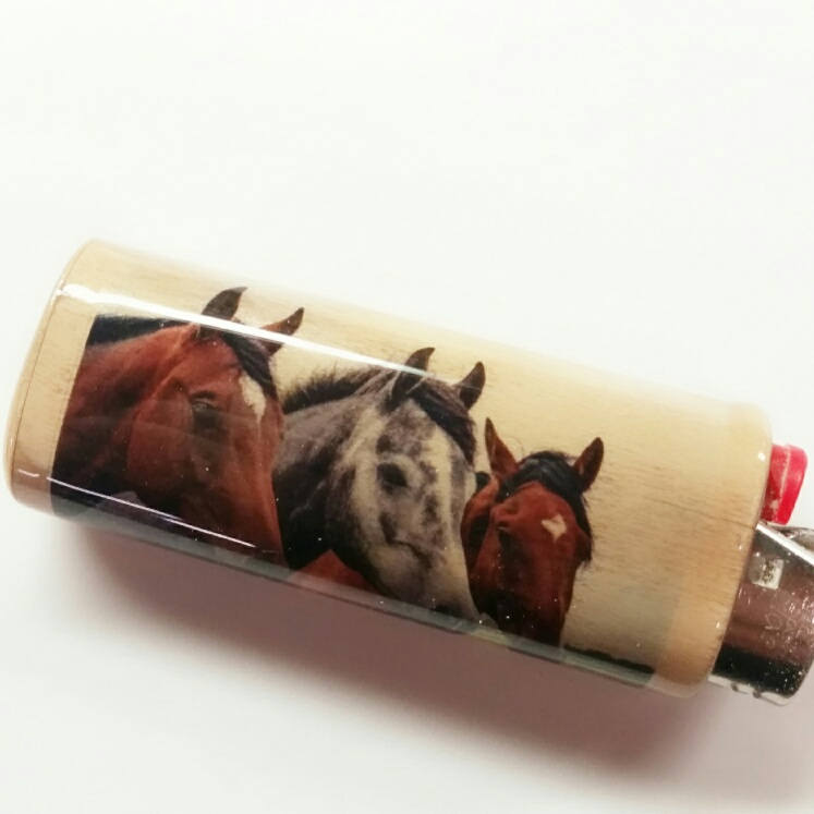 Cigarette case with images of horses on a white background