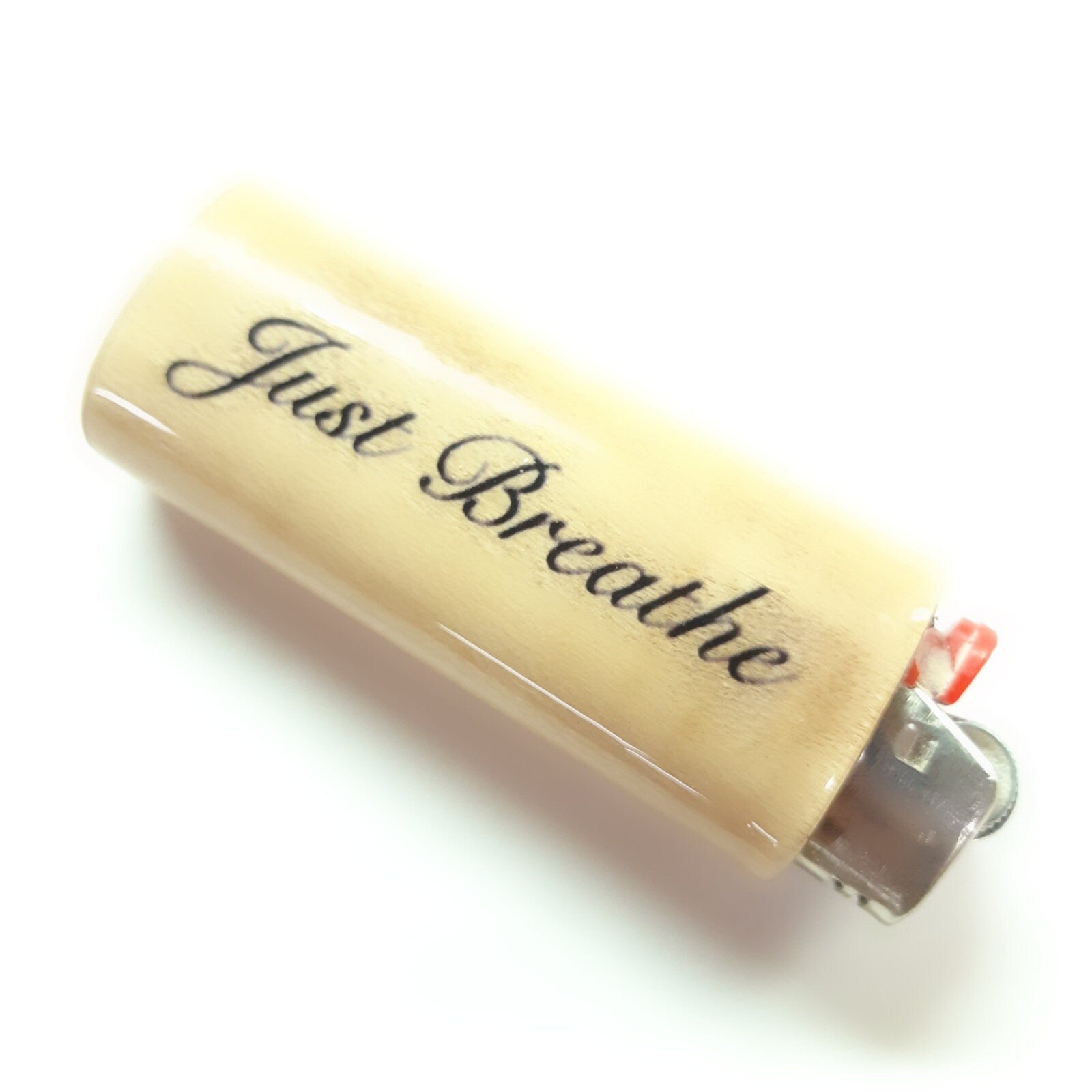 Lighter with 'Just Breathe' text on a white background