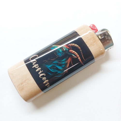 Lighter with Capricorn zodiac design on a white background