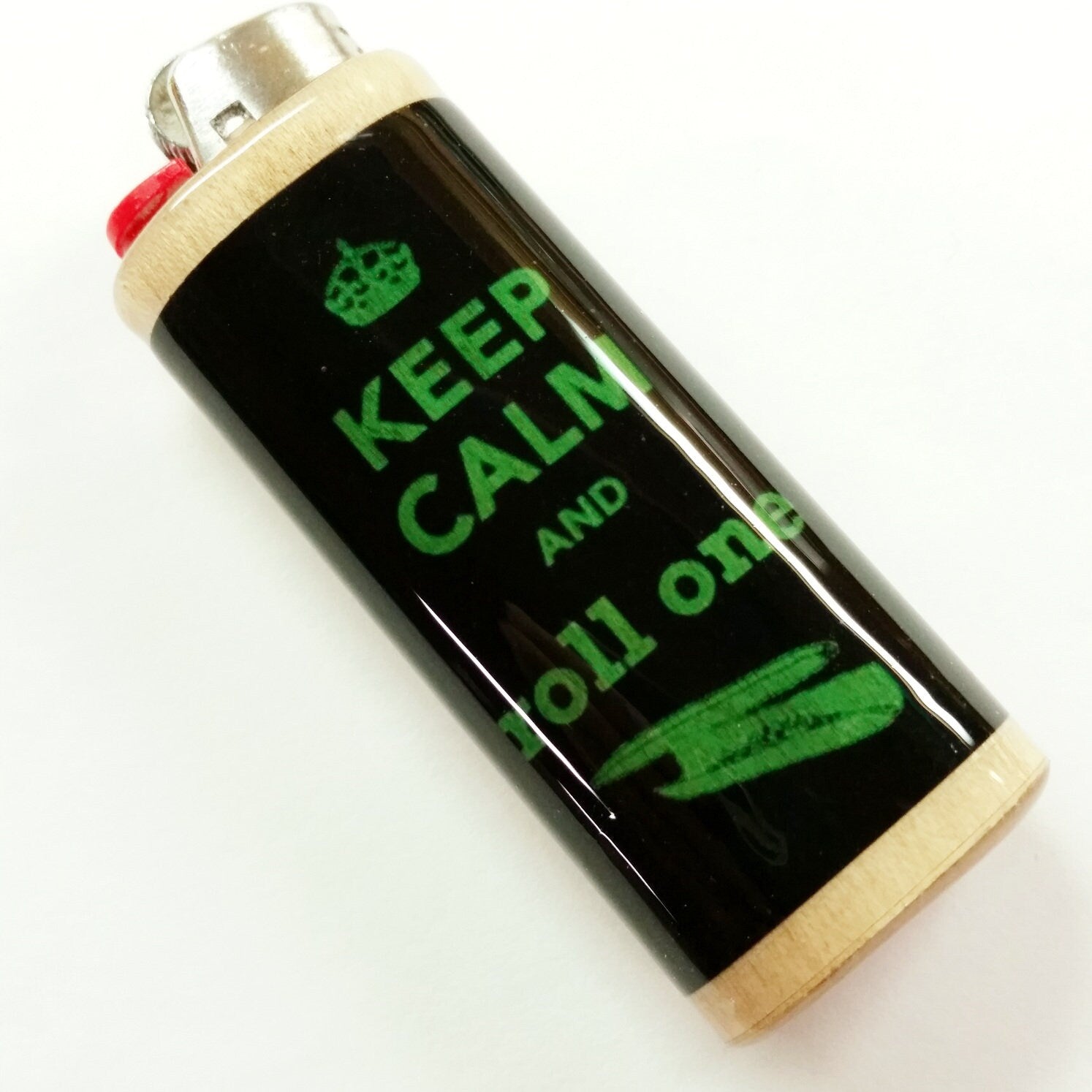 Lighter with 'Keep Calm and Roll One' text on a white background