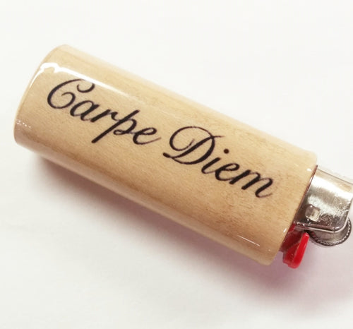 Lighter with 'Carpe Diem' engraving on a white background