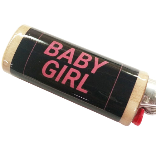 Roll of black tape with 'BABY GIRL' text on a white background
