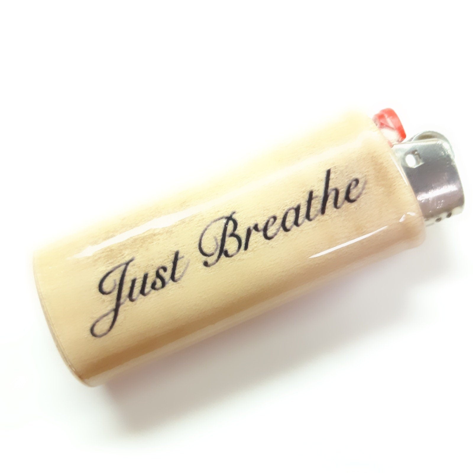 Lighter with 'Just Breathe' text on a white background