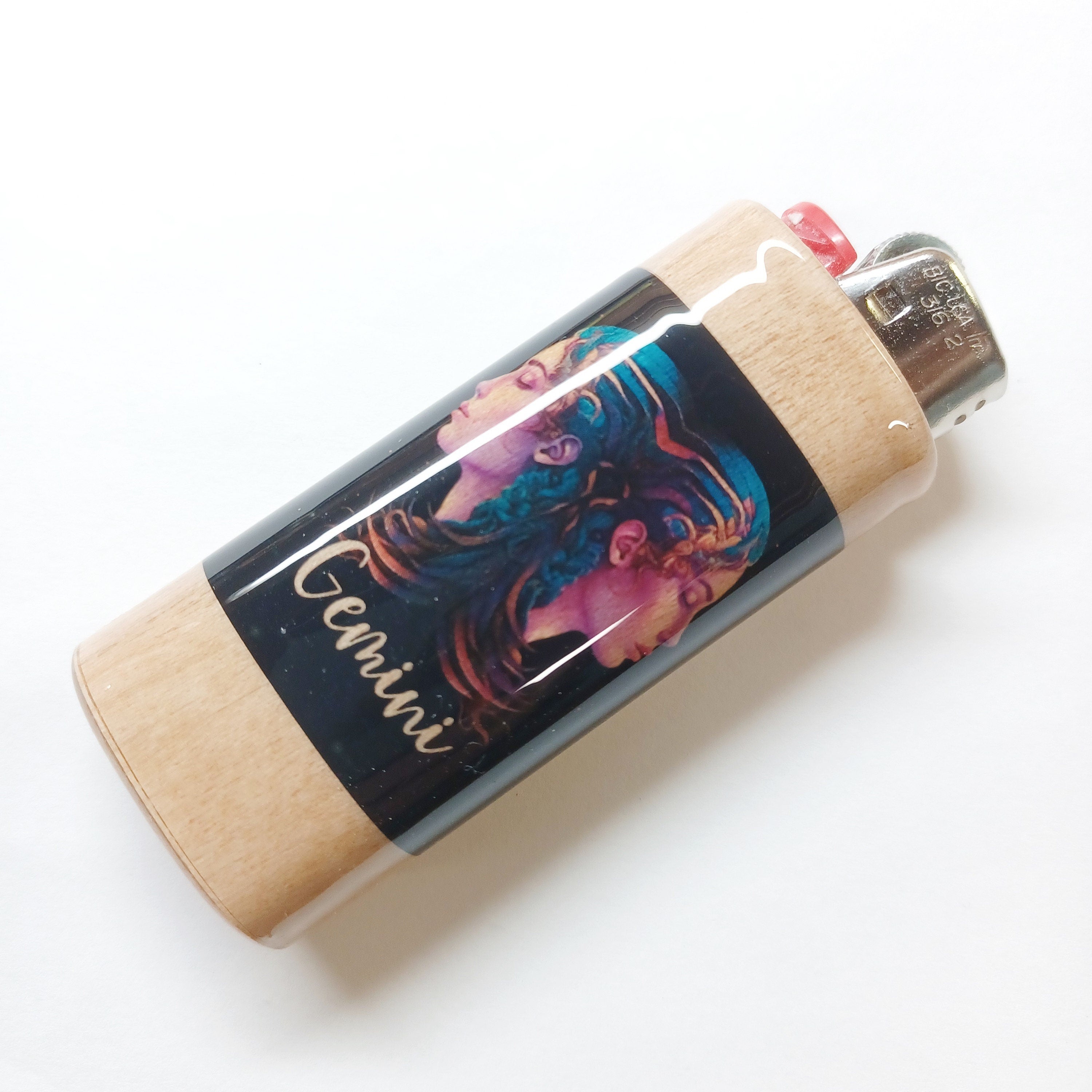 Lighter with a colorful design and 'Gemini' text on a white background