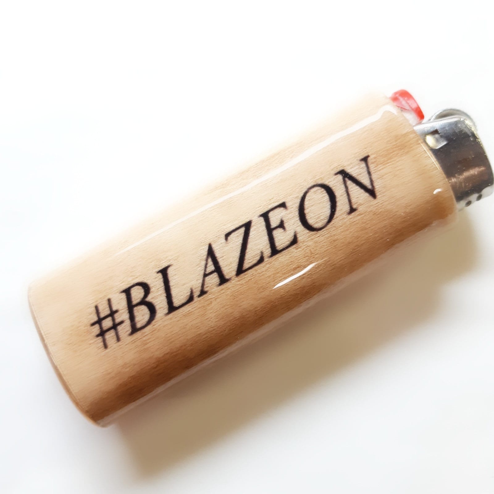 Lighter with '#BLAZEON' text on a white background