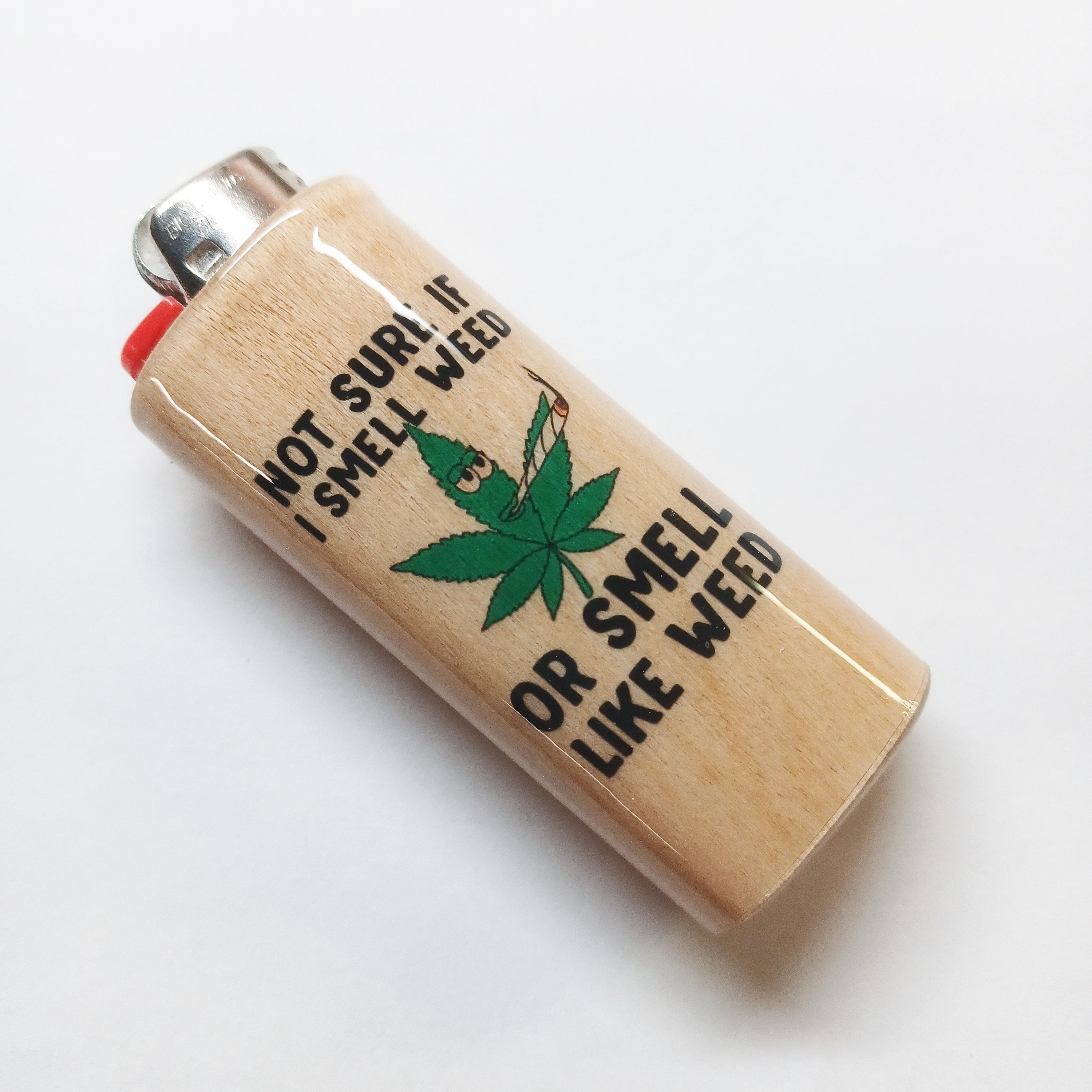 Lighter with pot leaf and text on a white background
