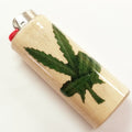 Lighter with a cannabis leaf design on a white background