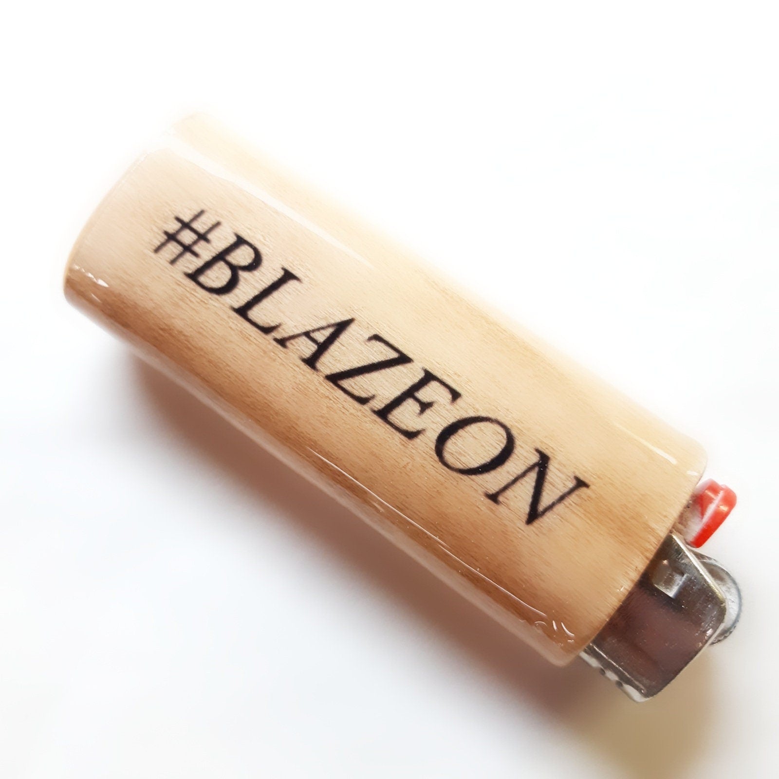 Lighter with '#BLAZEON' branding on a white background