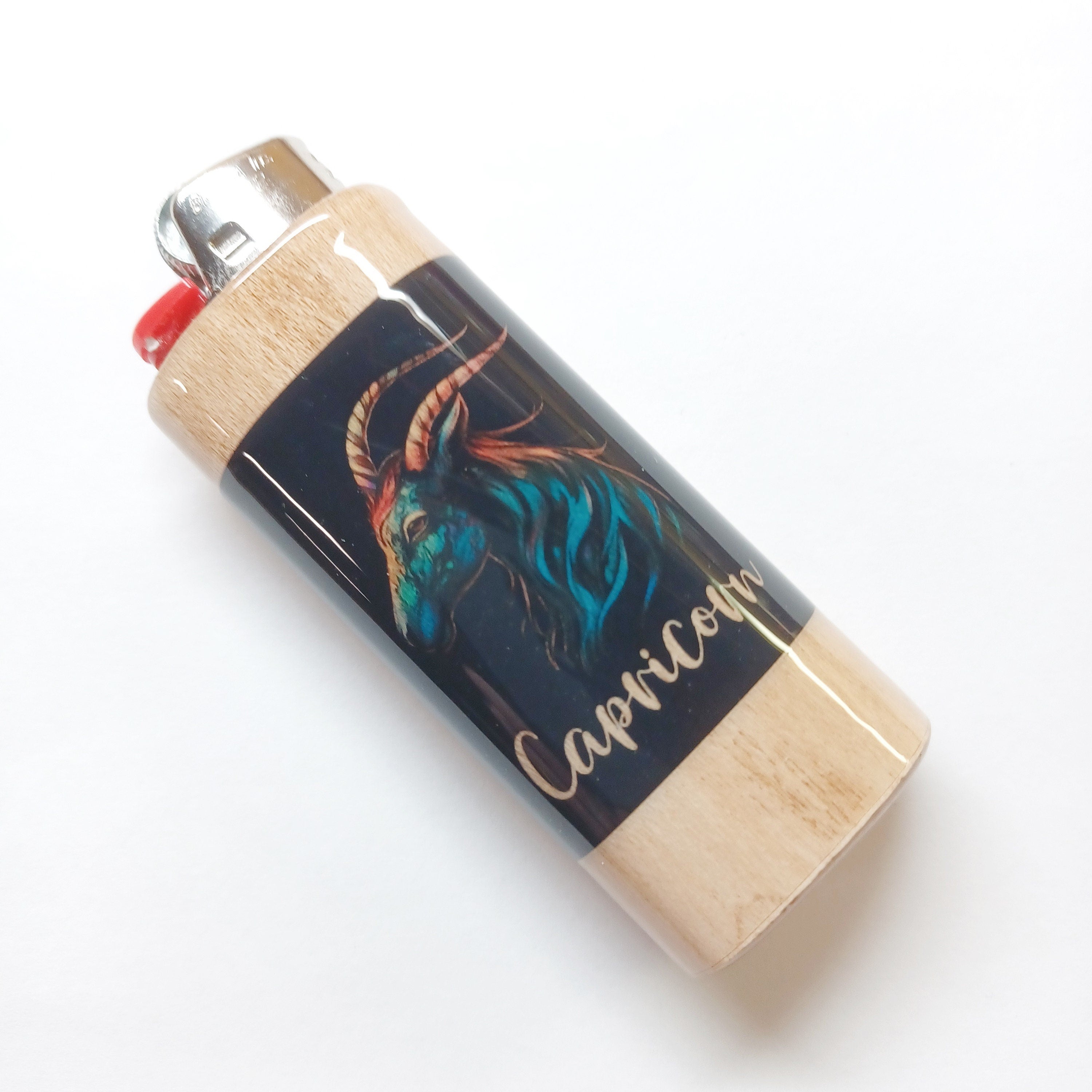 Lighter with Capricorn design on a white background