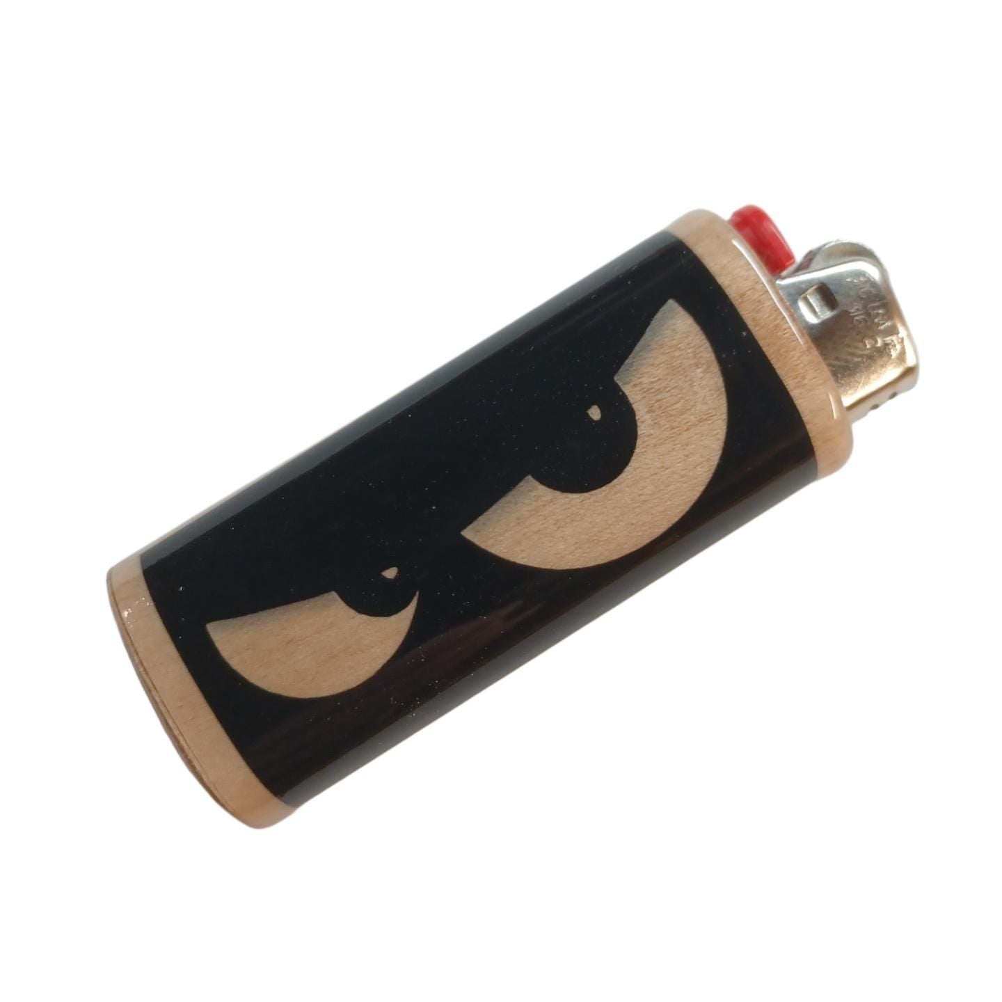 Lighter with a design of eyes on a black background
