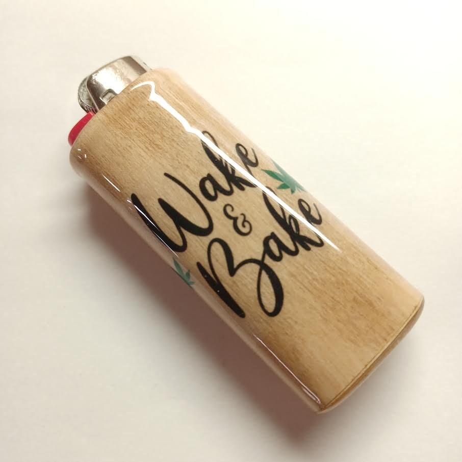 Lighter with 'Wake & Bake' text on a beige background
