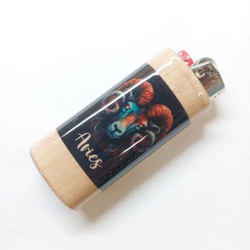 Lighter with Aries zodiac design on a white background