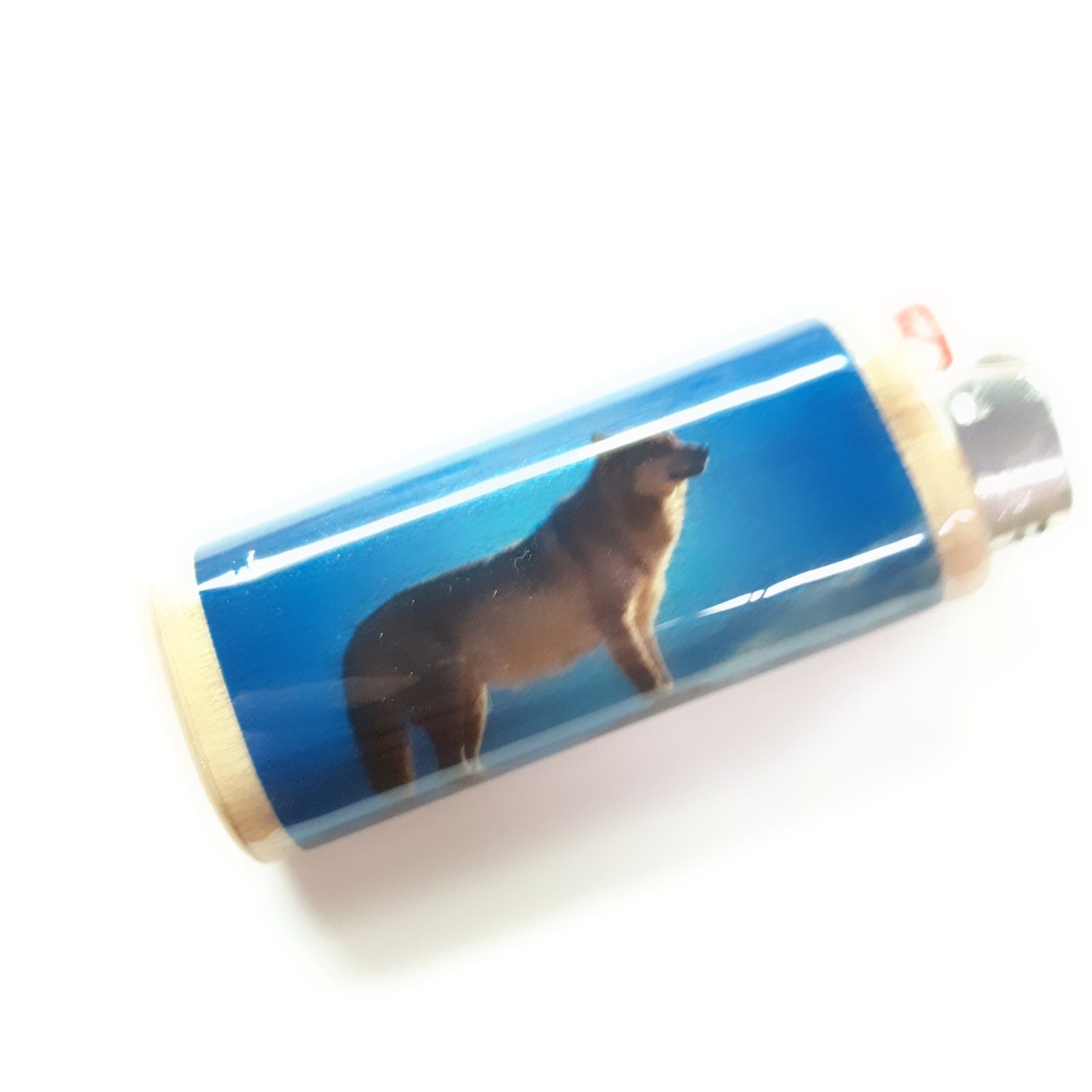 Lighter case with a wolf design on a white background