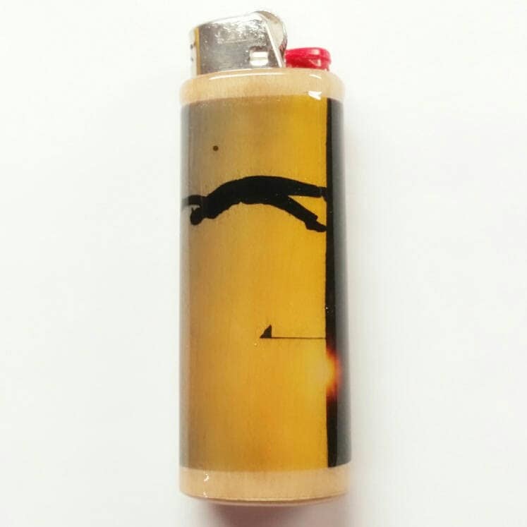 Lighter with a design of a golfer on a white background