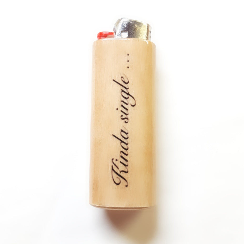 Beige lighter with 'Kinda single' text on a white background