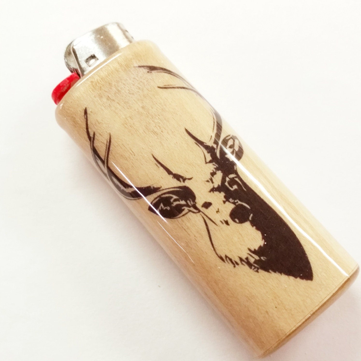 Lighter with a deer design on a white background