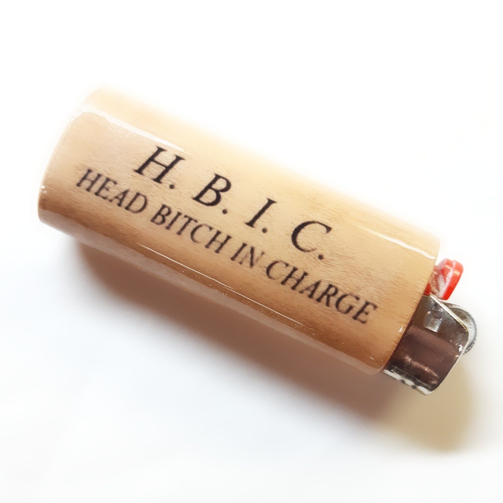 Lighter with 'H. B. I. C. HEAD BITCH IN CHARGE' text on a white background