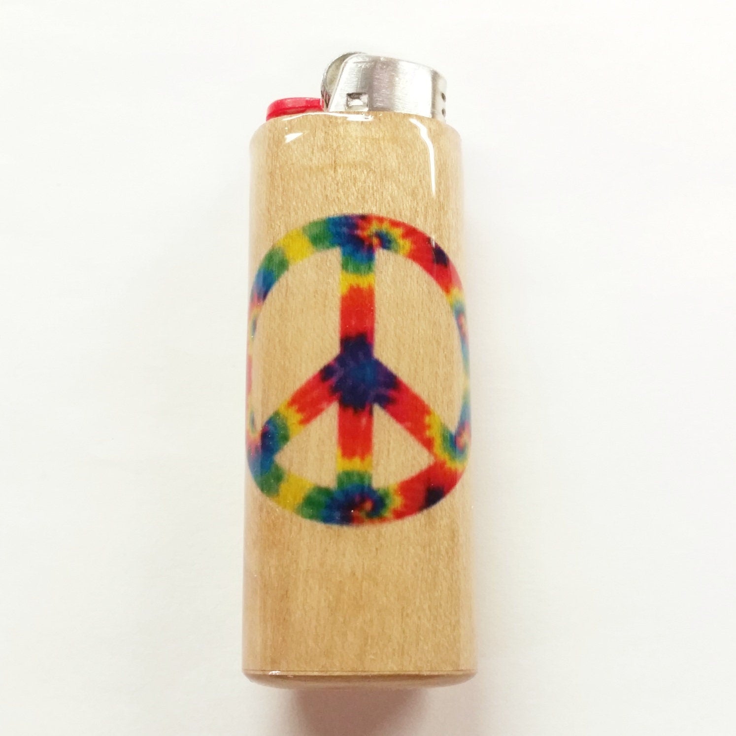 Lighter with a rainbow peace symbol design on a beige background