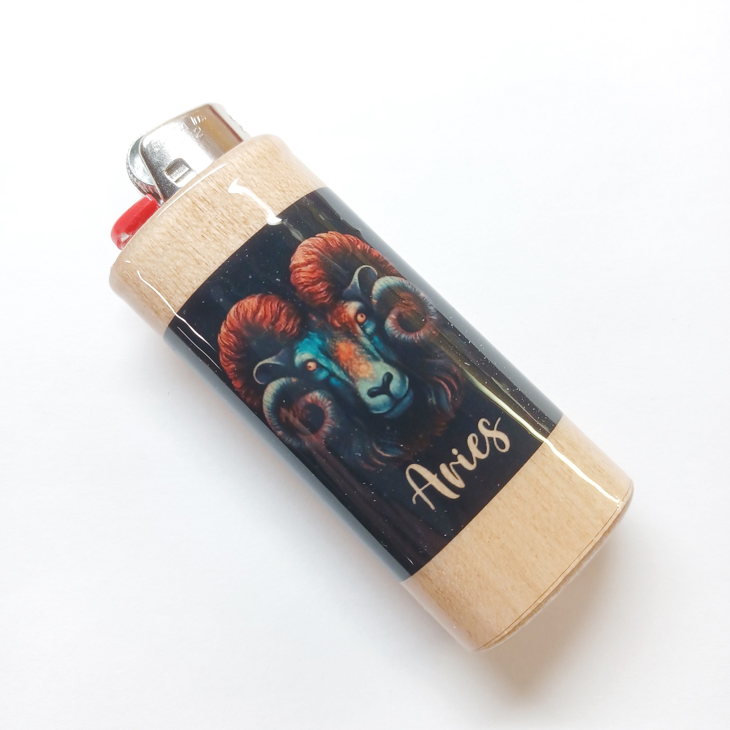 Lighter with Aries zodiac design on a white background