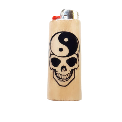 Lighter with skull and yin yang design on a white background