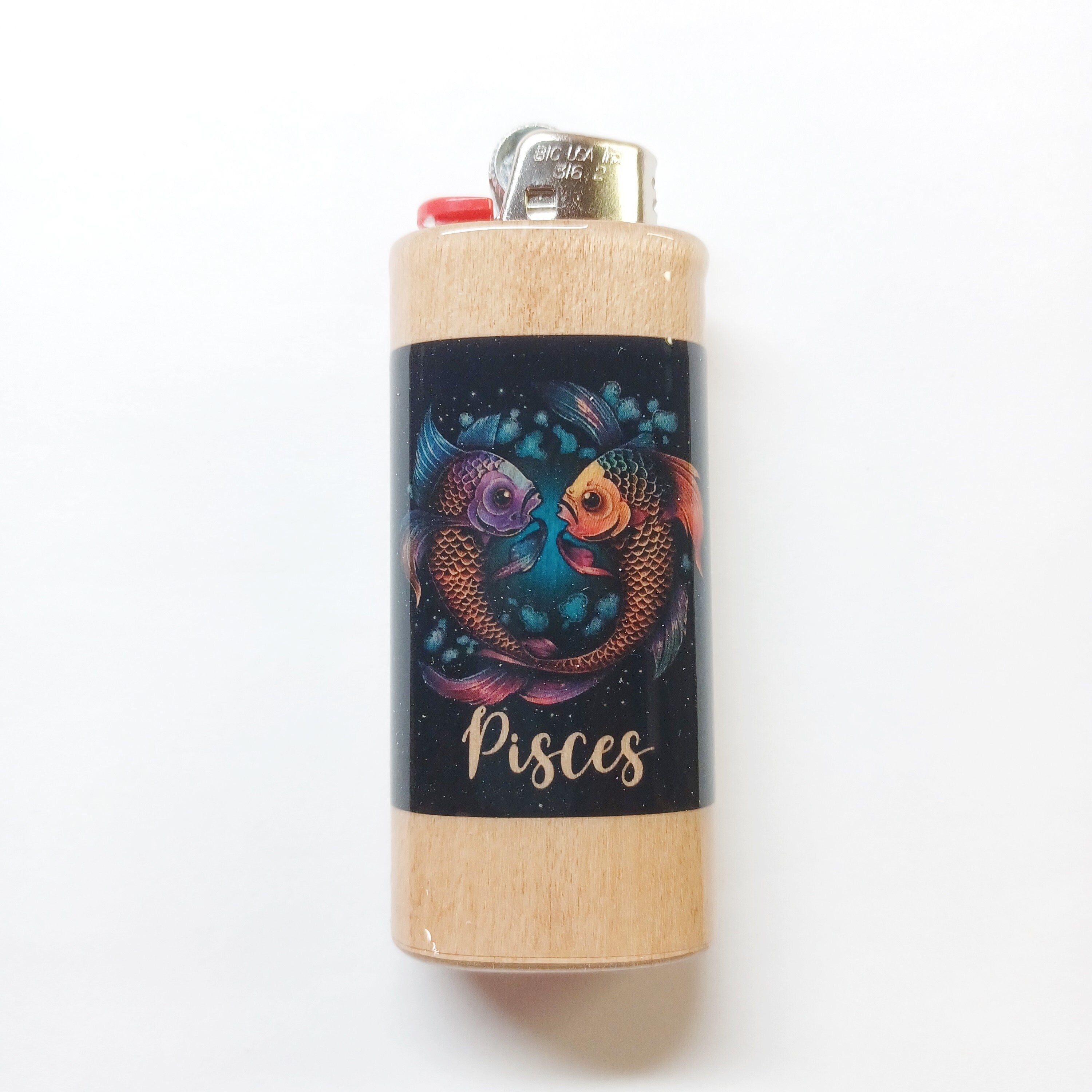 Lighter with Pisces design on a white background