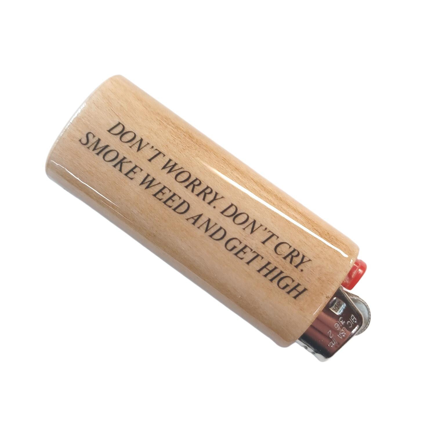 Wooden lighter with text 'Don't worry, don't cry, smoke weed and get high' on a white background
