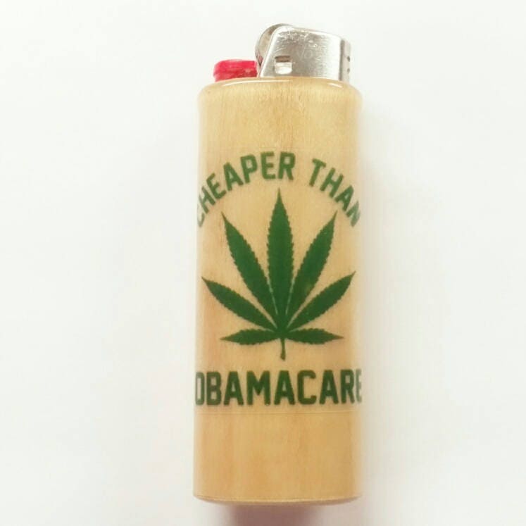 Lighter with a cannabis leaf design and text on a white background