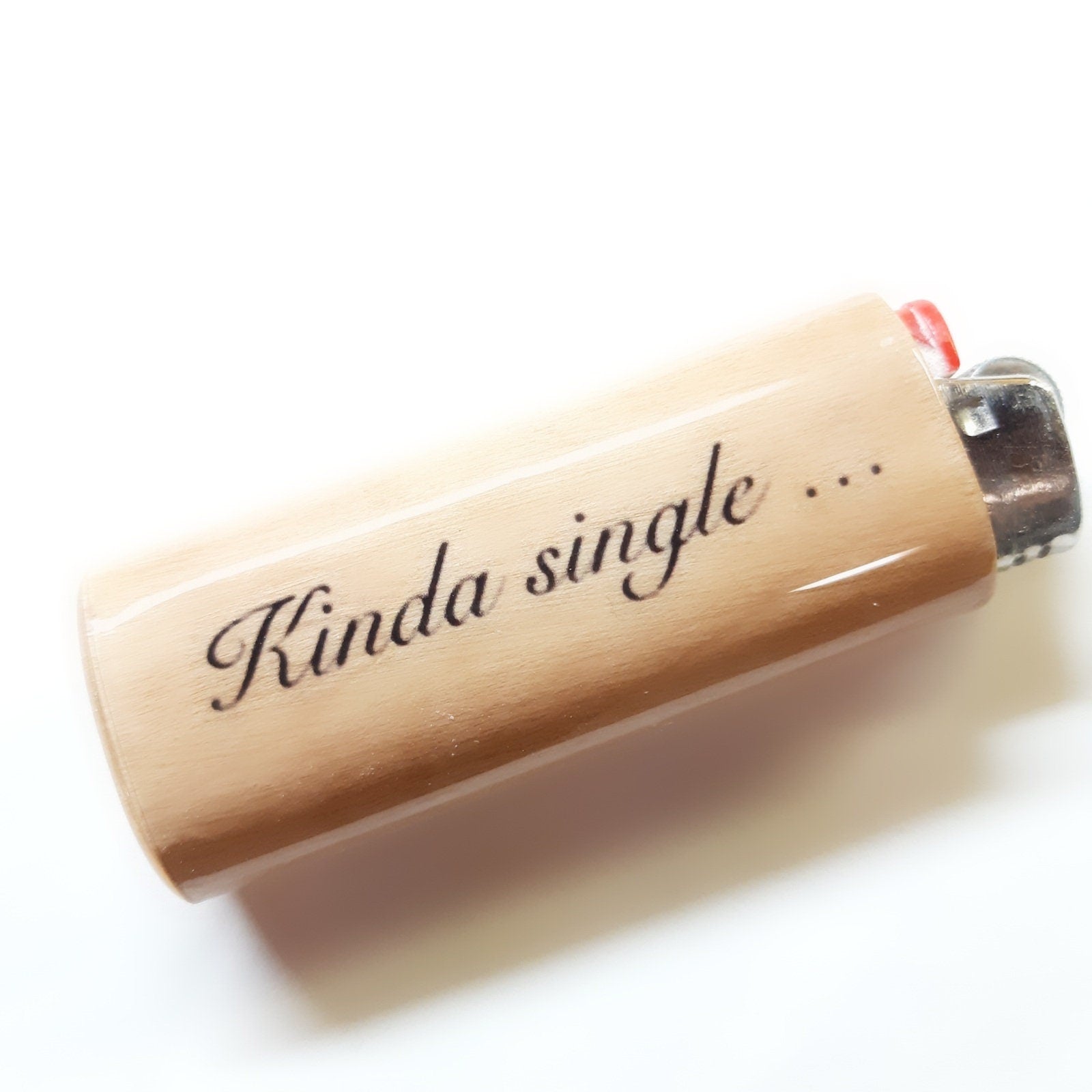 Lighter with 'Kinda single' text on a white background