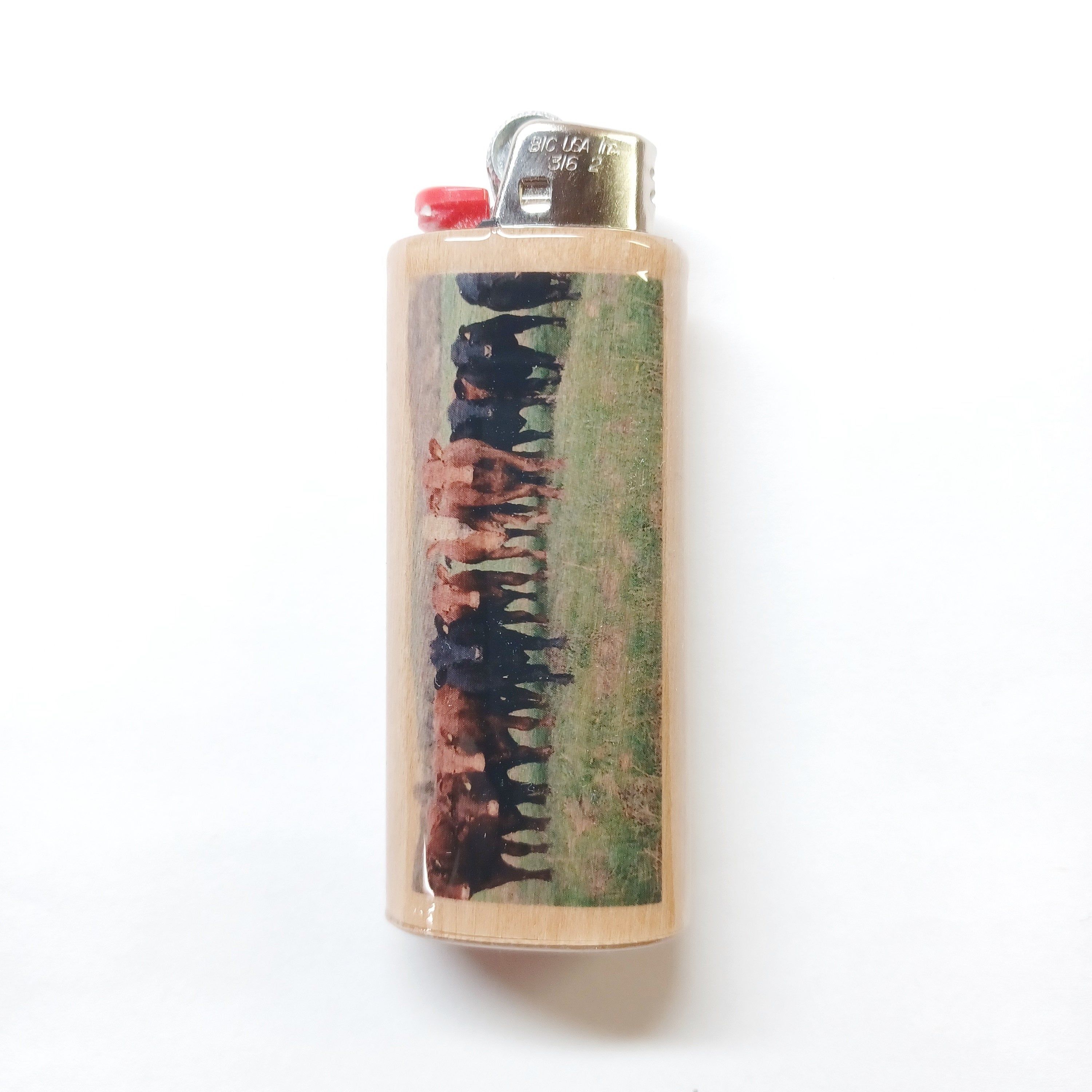 Lighter with a cows design on a white background