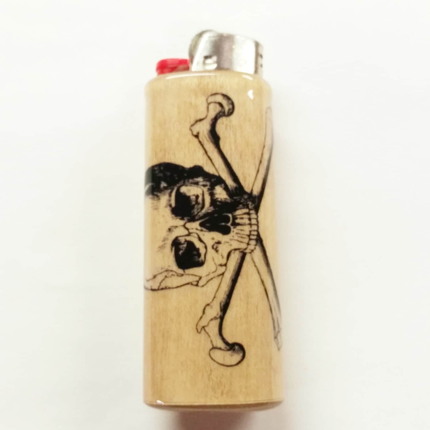 Wooden lighter with skull and crossbones design on a white background