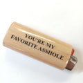 Wooden lighter with text 'YOU'RE MY FAVORITE ASSHOLE' on a white background