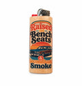 A novelty lighter with a light wood grain finish, featuring a retro-style printed graphic that reads 'Raised on Bench Seats & Secondhand Smoke' with an illustration of a station wagon. It has a red ignition button and a silver metal top.