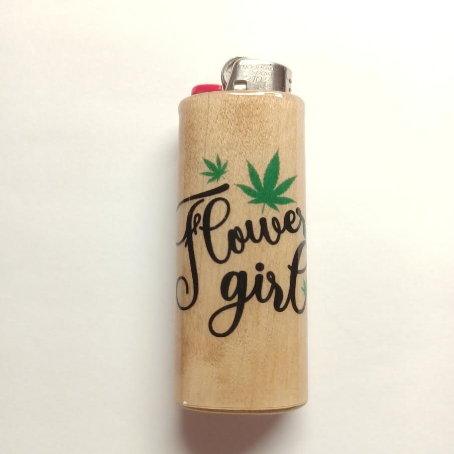 Lighter with 'Flower girl' text and cannabis leaf designs on a beige background