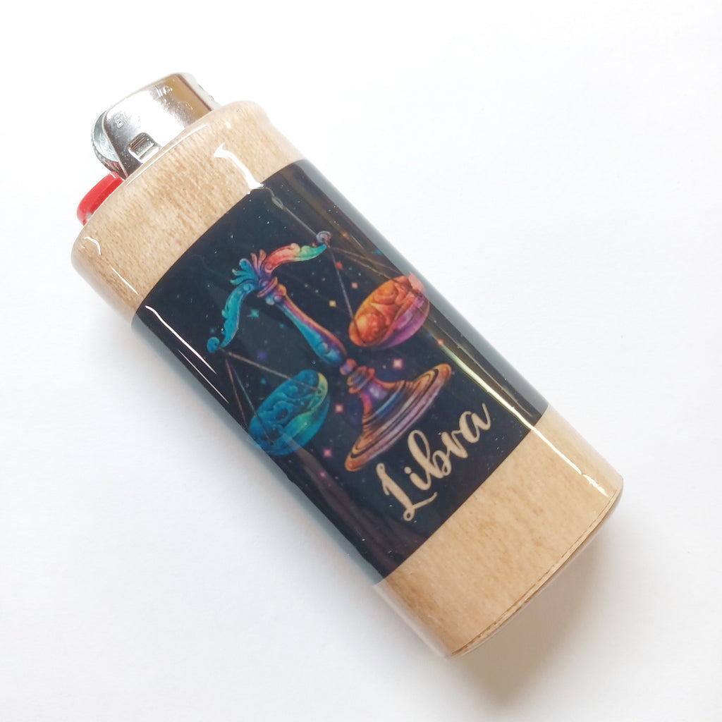 Lighter with Libra zodiac design on a white background