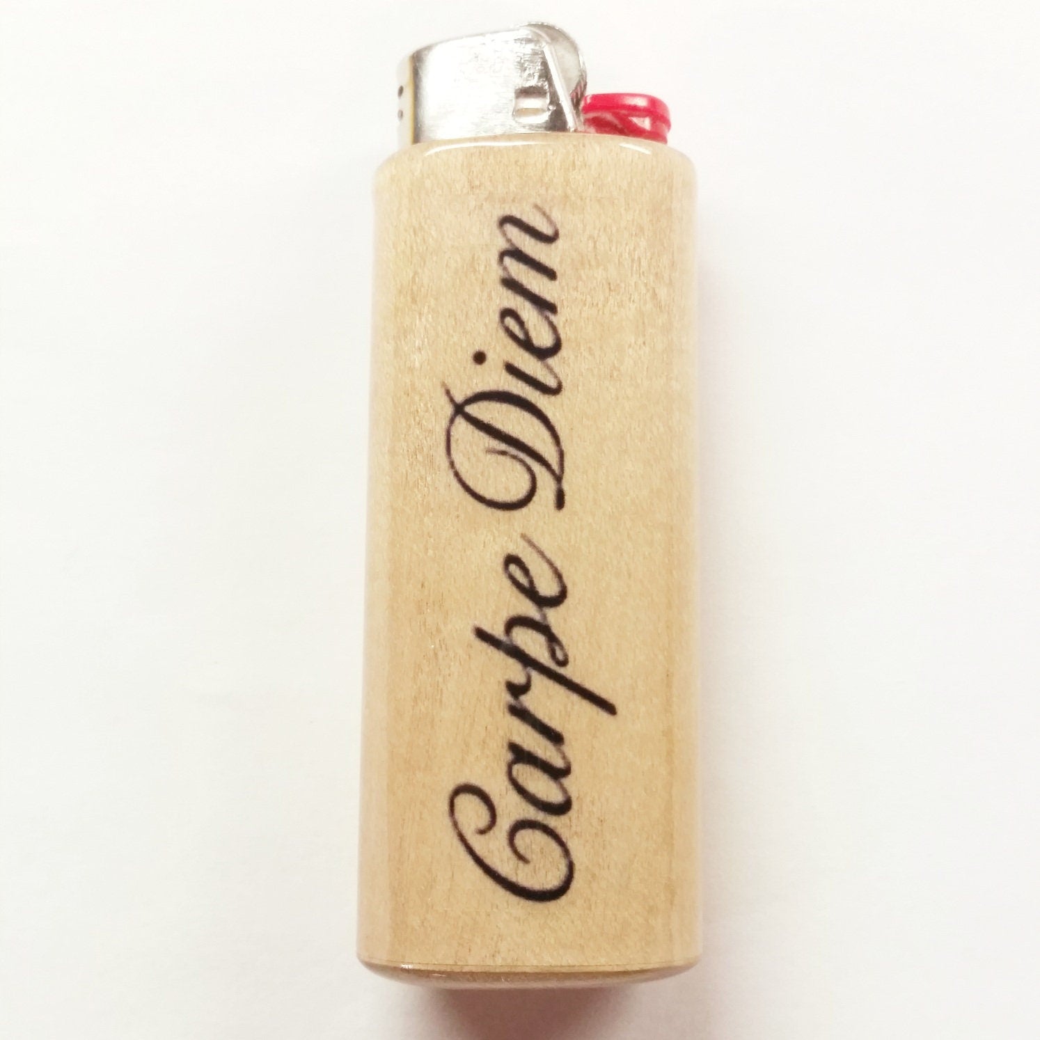 Lighter with 'Carpe Diem' engraving on a white background