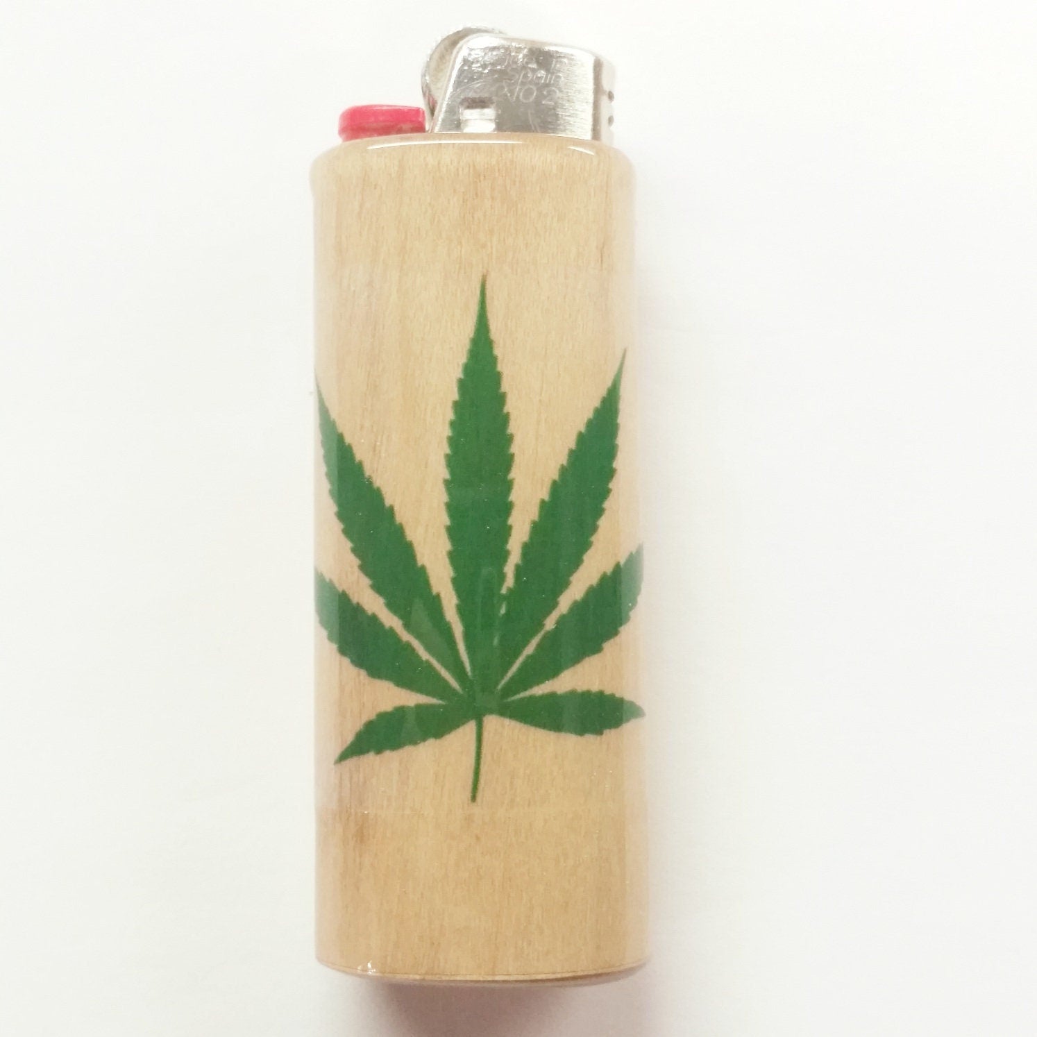 Lighter with a cannabis leaf design on a white background