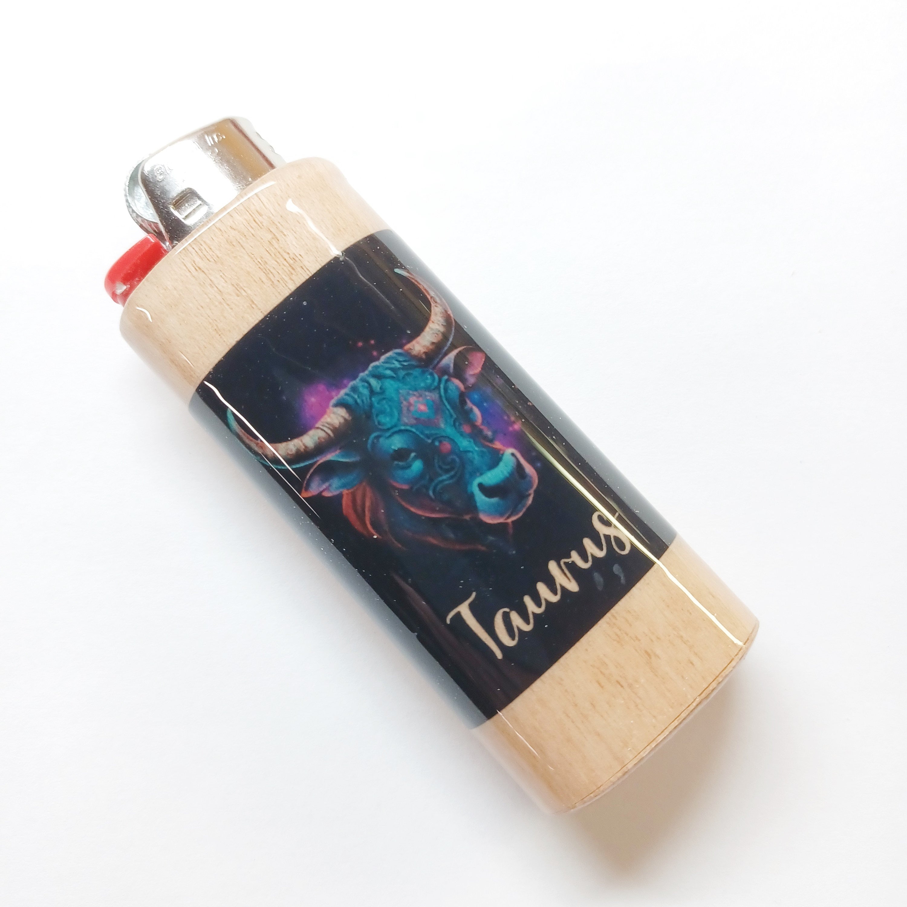 Lighter with Taurus design on a white background